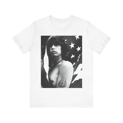 A black graphic t-shirt featuring a retro 70s-style illustration or photo of Aerosmith, integrated with elements of the American flag.