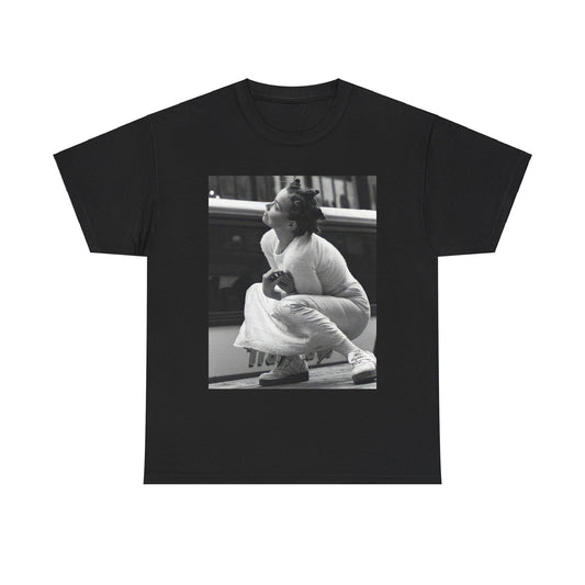 A black graphic t-shirt featuring a graphic of Bjork as an experimental pop icon.