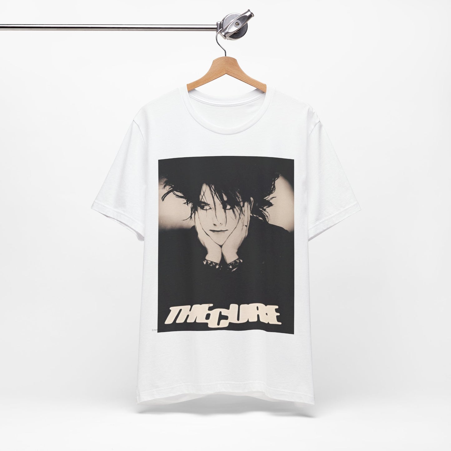 A black graphic t-shirt featuring a graphic of The Cure with cool new wave vibes.