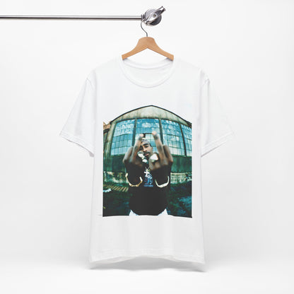 A black graphic t-shirt featuring a graphic of Tupac giving the middle finger.