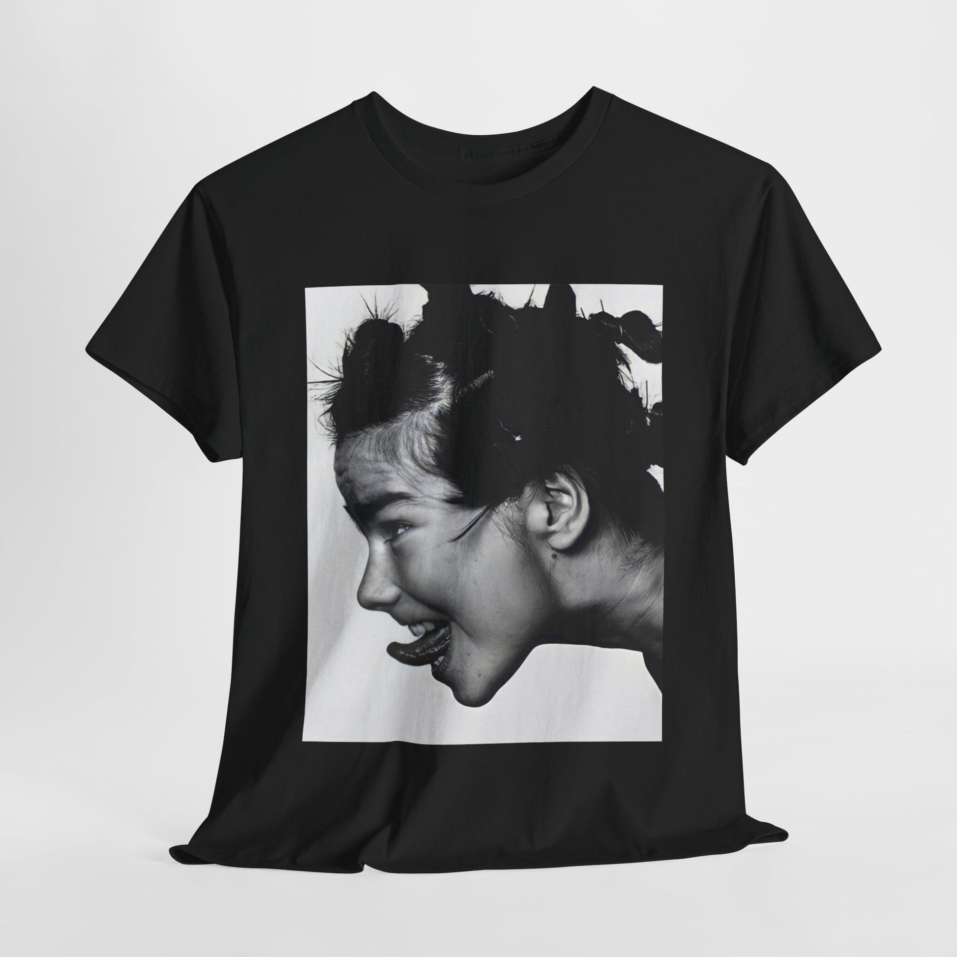 A black graphic t-shirt featuring a graphic of Bjork, designed with an indie 90s aesthetic.