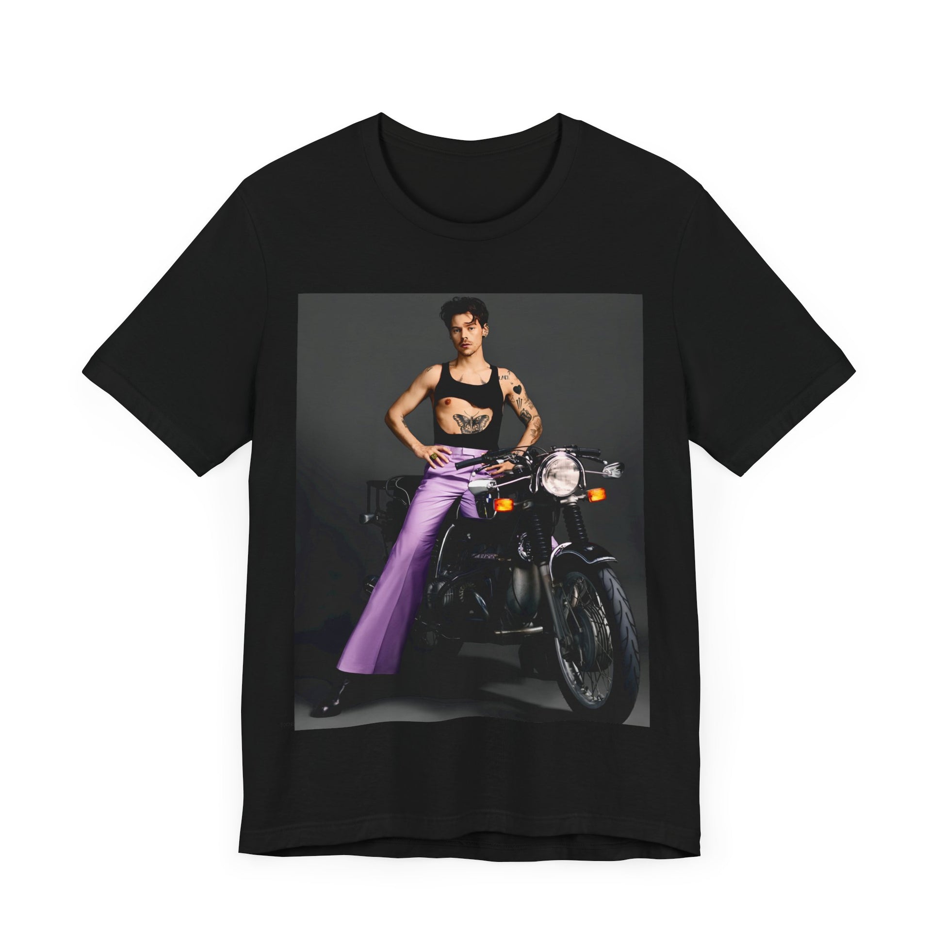 A black graphic t-shirt featuring a graphic of Harry Styles related to motorcycles or a rebellious, cool style.