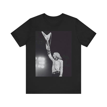 A black graphic t-shirt featuring a graphic or photo of Tom Petty playing guitar on stage.