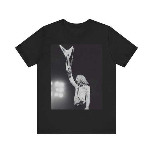 A black graphic t-shirt featuring a graphic or photo of Tom Petty playing guitar on stage.