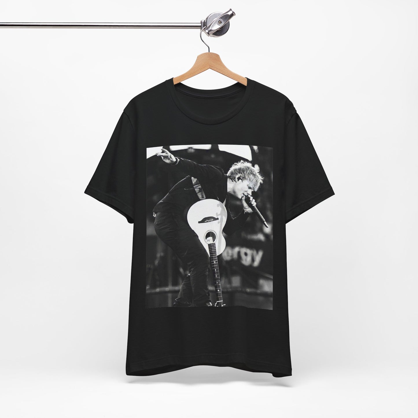 A black graphic t-shirt featuring a vintage graphic of Ed Sheeran performing live.
