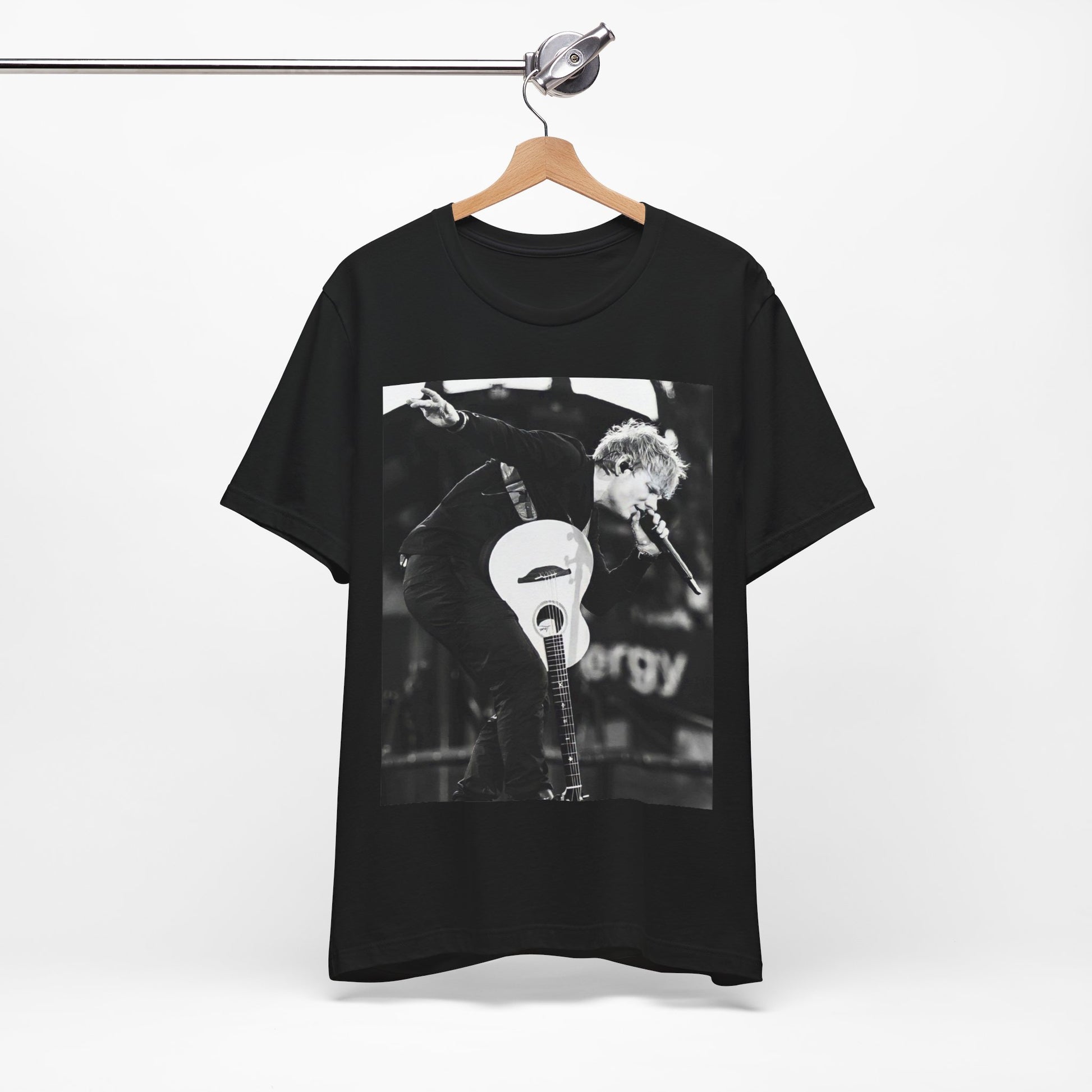 A black graphic t-shirt featuring a vintage graphic of Ed Sheeran performing live.