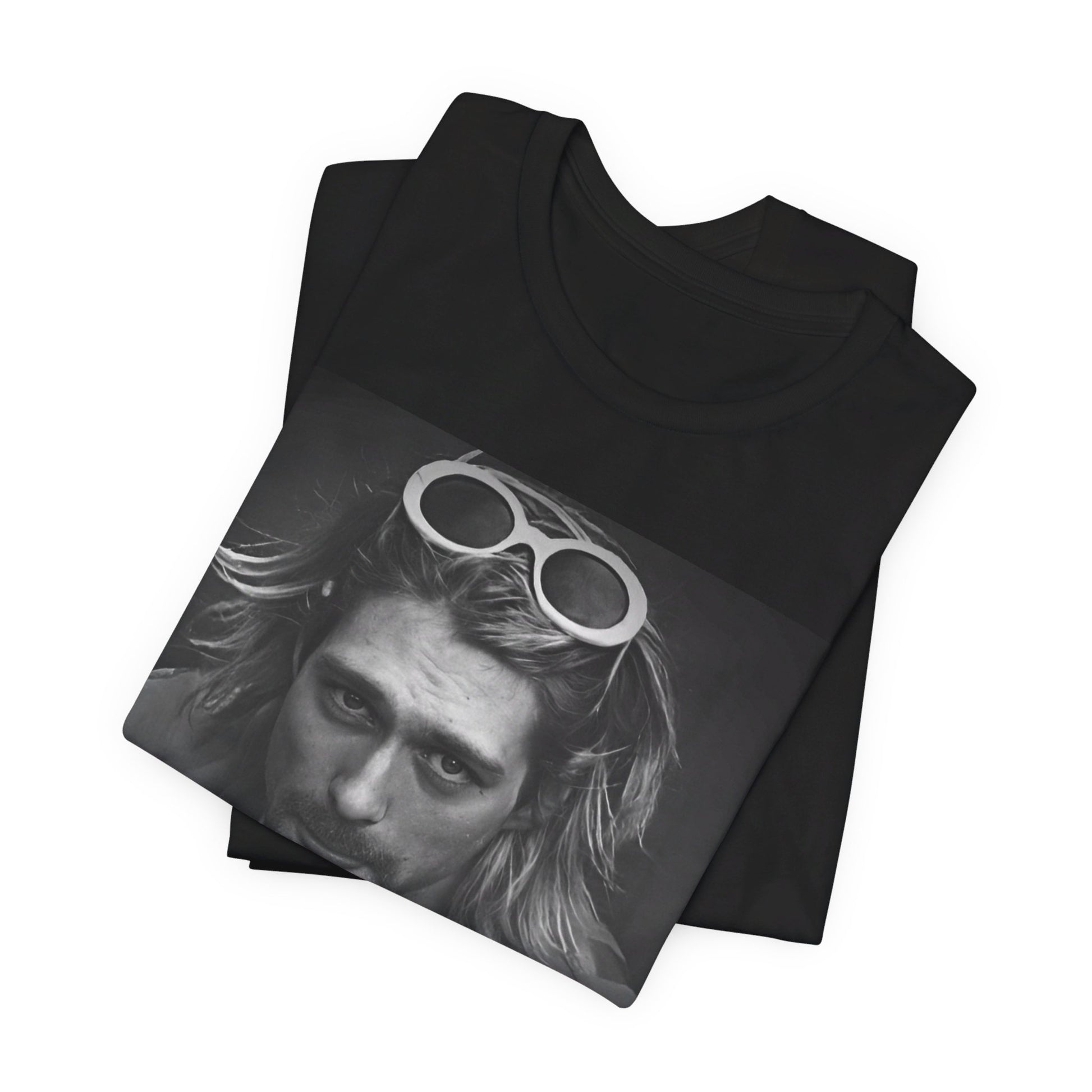 A black graphic t-shirt featuring a photo of Kurt Cobain from Nirvana wearing sunglasses.
