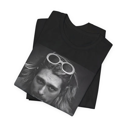 A black graphic t-shirt featuring a photo of Kurt Cobain from Nirvana wearing sunglasses.
