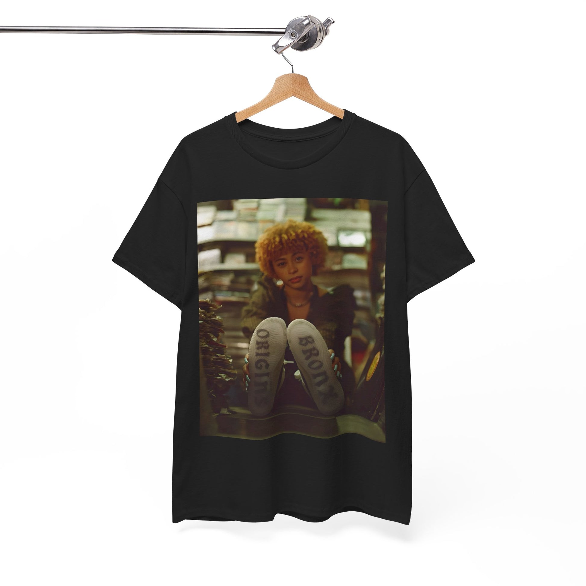 A black graphic t-shirt featuring a stylized graphic of Ice Spice as a TikTok Queen or global sensation.