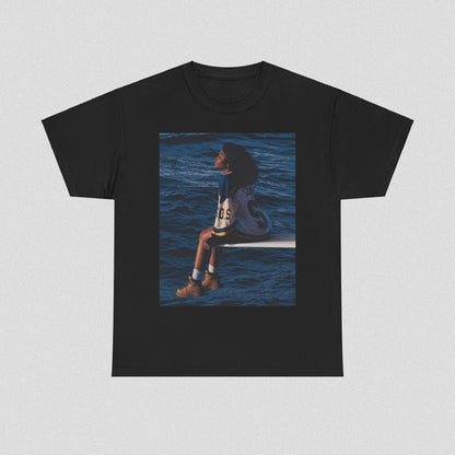 A black graphic t-shirt featuring a graphic related to SZA's 'SOS' album.