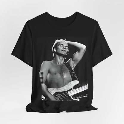 A black graphic t-shirt featuring a graphic or photo of Sting performing live on stage in 1983.