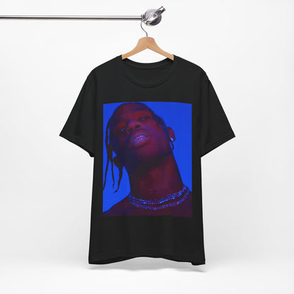 A black graphic t-shirt featuring a bold graphic of Travis Scott as a rap superstar.