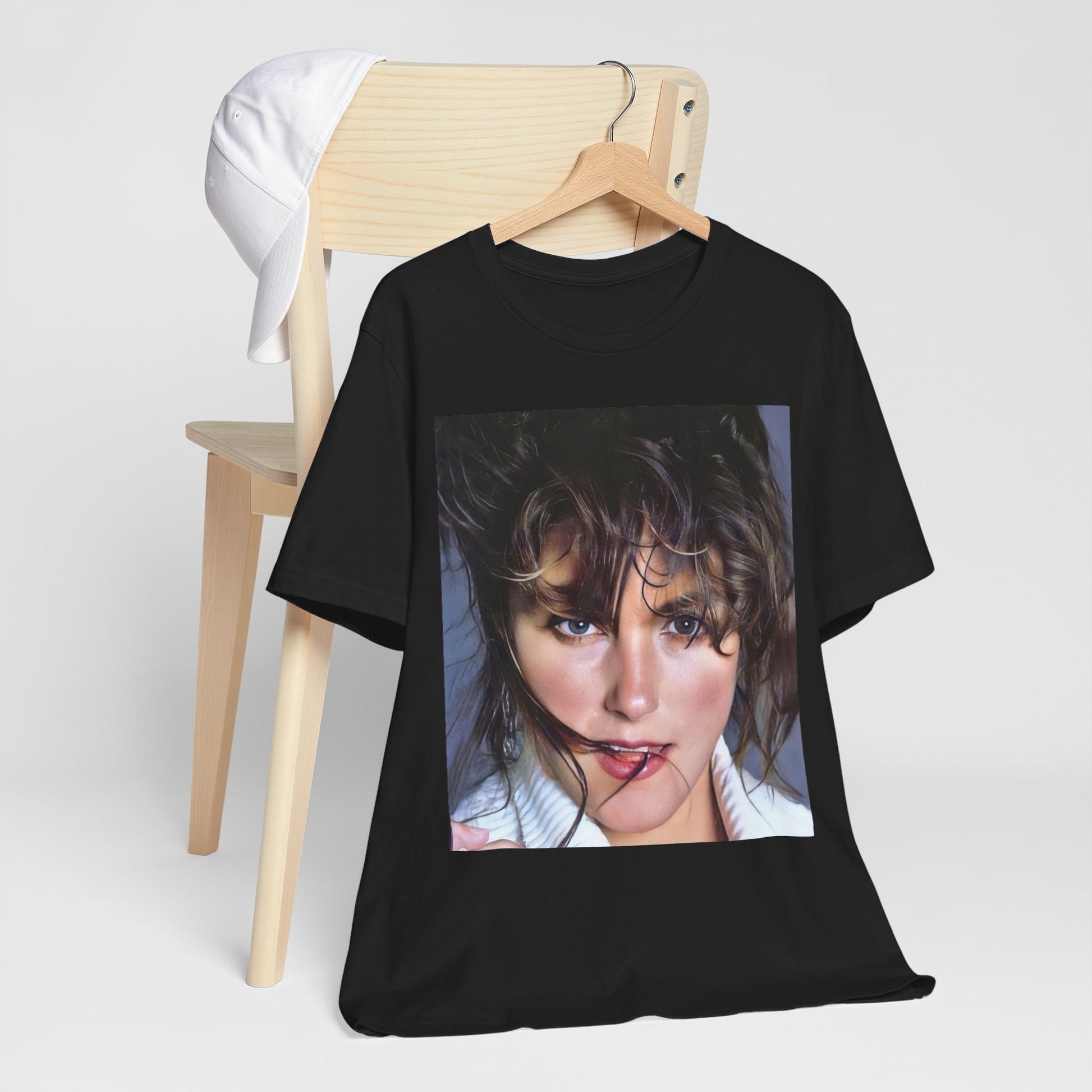 A black graphic t-shirt featuring an 80s style graphic of Laura Branigan.
