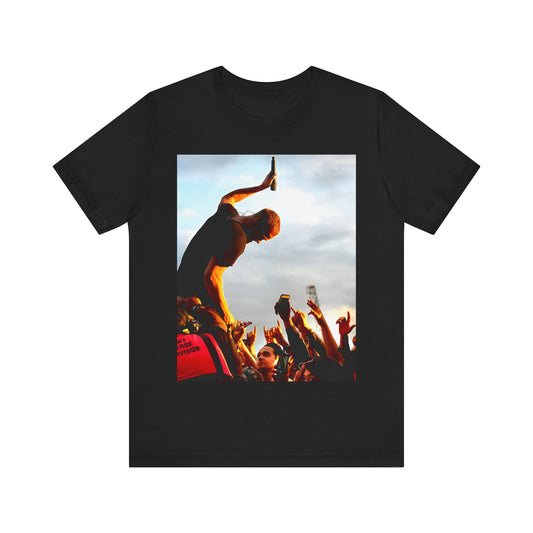 A black graphic t-shirt featuring a graphic of Dan Reynolds from Imagine Dragons performing live.