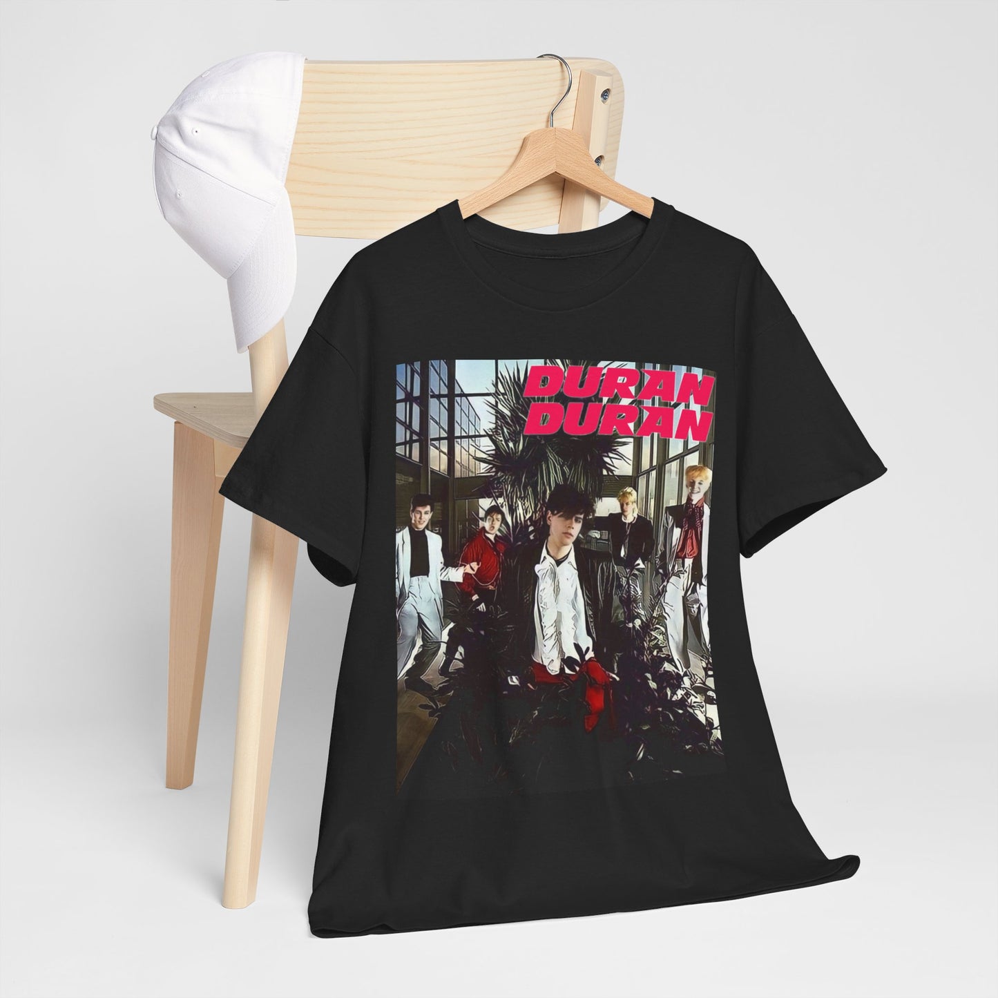 A black graphic t-shirt featuring a graphic of Duran Duran with a chill 80s pop vibe.