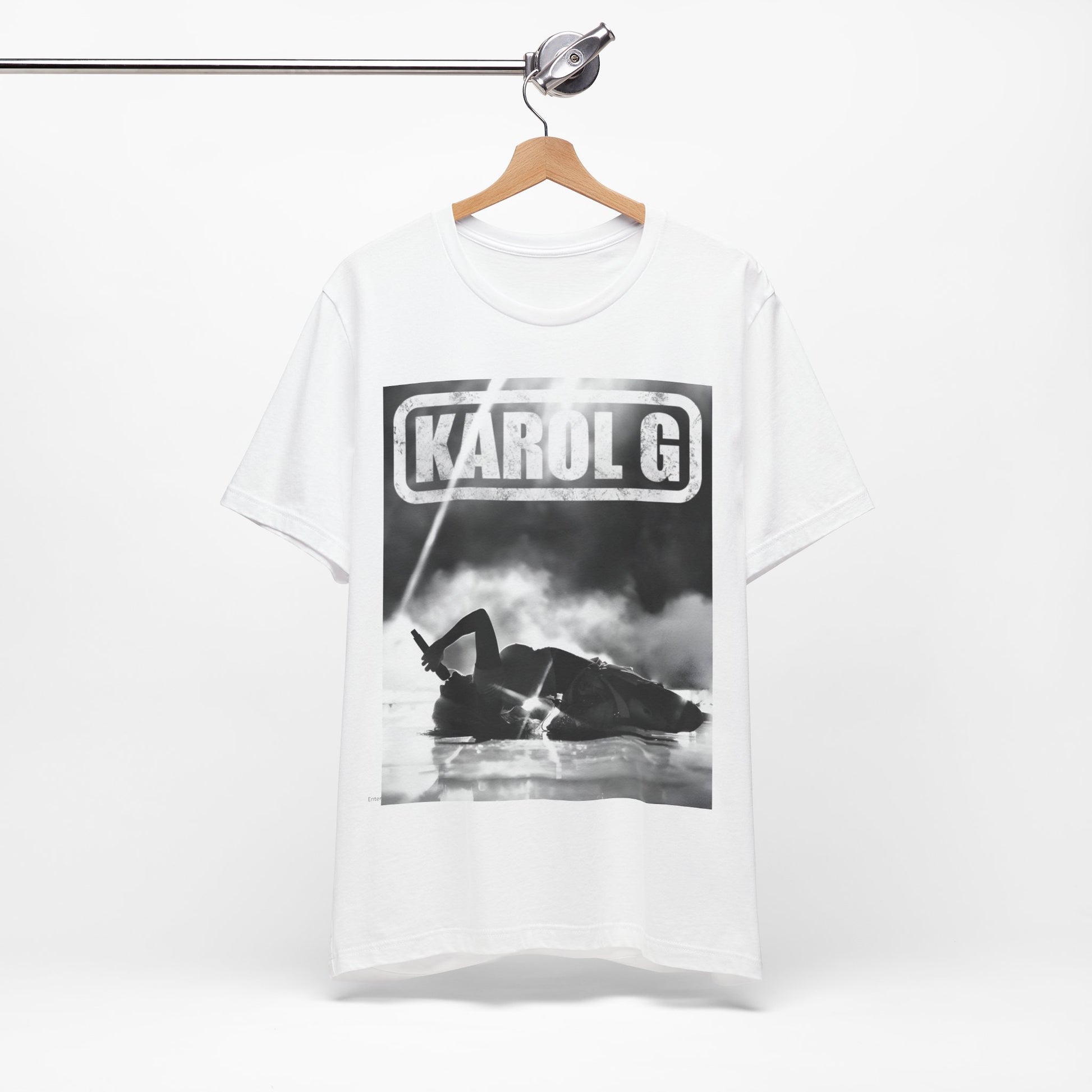 A black graphic t-shirt featuring a black and white graphic or photo of Karol G performing live on stage.
