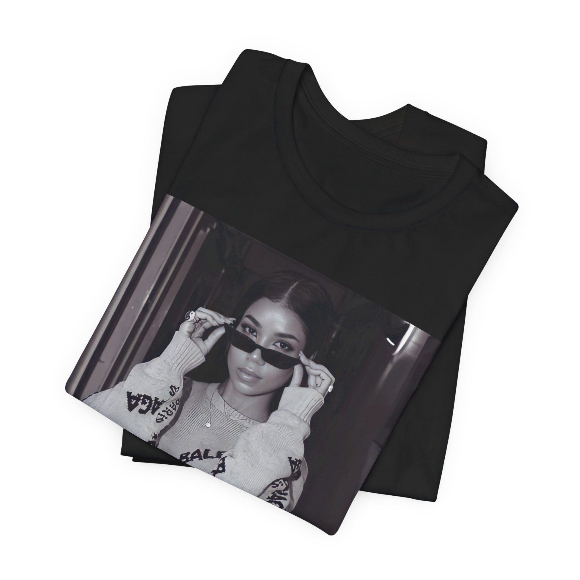 A black graphic t-shirt featuring a black and white, monochrome graphic or photo of Jhene Aiko.