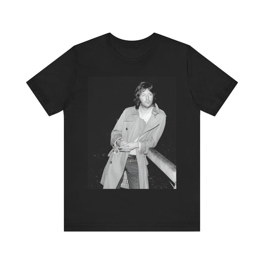 A black graphic t-shirt featuring a retro graphic of Eric Clapton as a blues master.