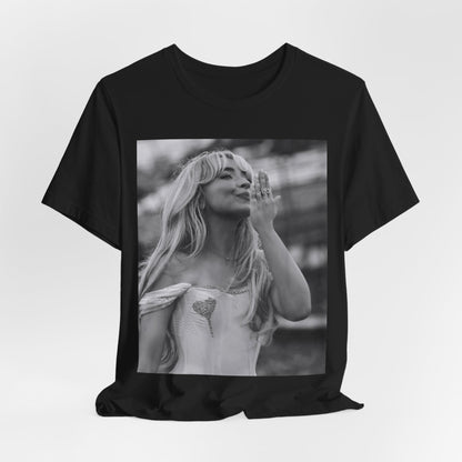 A black graphic t-shirt featuring a graphic or photo of Sabrina Carpenter kissing on stage during a performance.