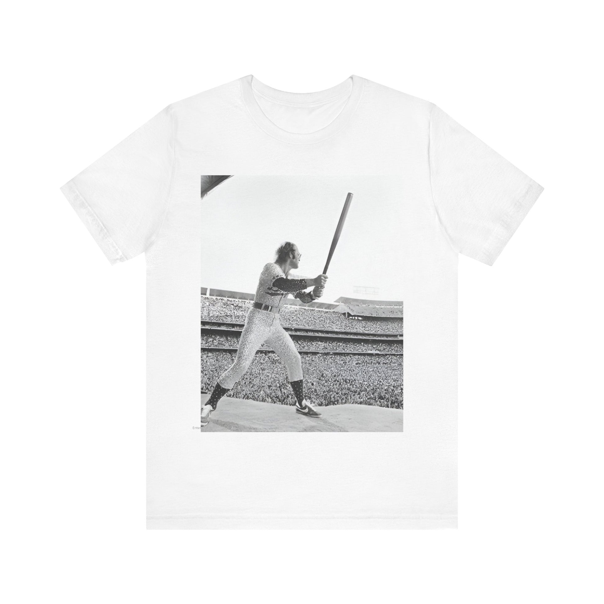A black graphic t-shirt featuring a black and white graphic or photo related to Elton John's 1975 tour in America.