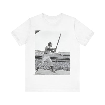 A black graphic t-shirt featuring a black and white graphic or photo related to Elton John's 1975 tour in America.