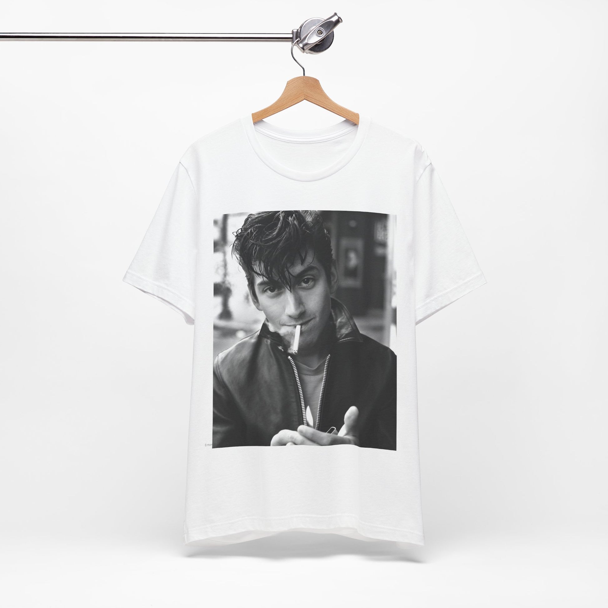 A black graphic t-shirt featuring a graphic of Alex Turner from Arctic Monkeys, in a rock star pose or setting.