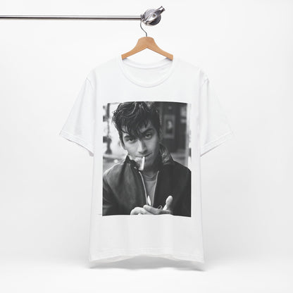 A black graphic t-shirt featuring a graphic of Alex Turner from Arctic Monkeys, in a rock star pose or setting.
