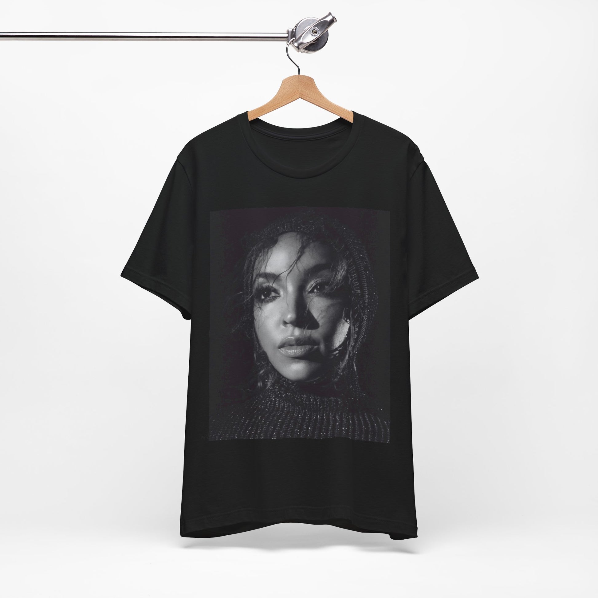 A black graphic t-shirt featuring a black and white portrait photo of Tinashe.