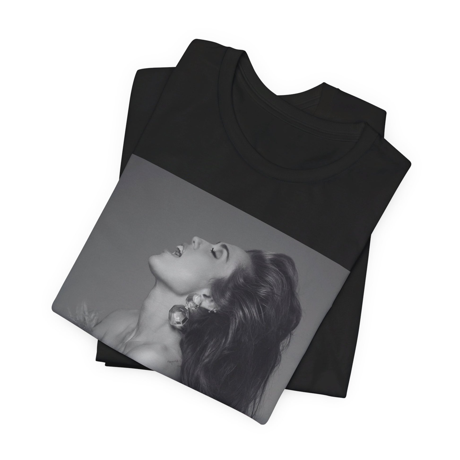 A black graphic t-shirt featuring a black and white portrait photo of Miley Cyrus.