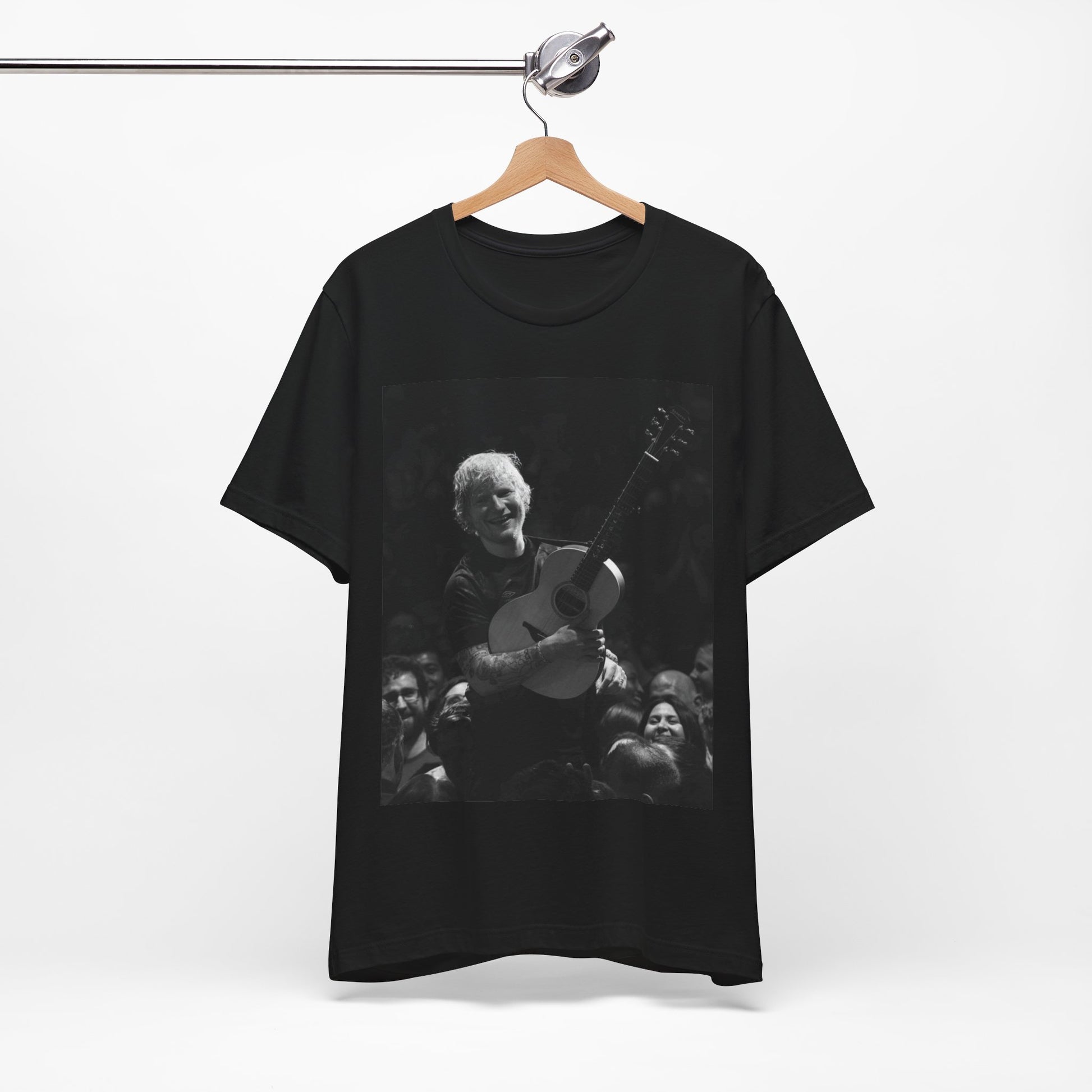 A black graphic t-shirt featuring a photo of Ed Sheeran performing live with his guitar.