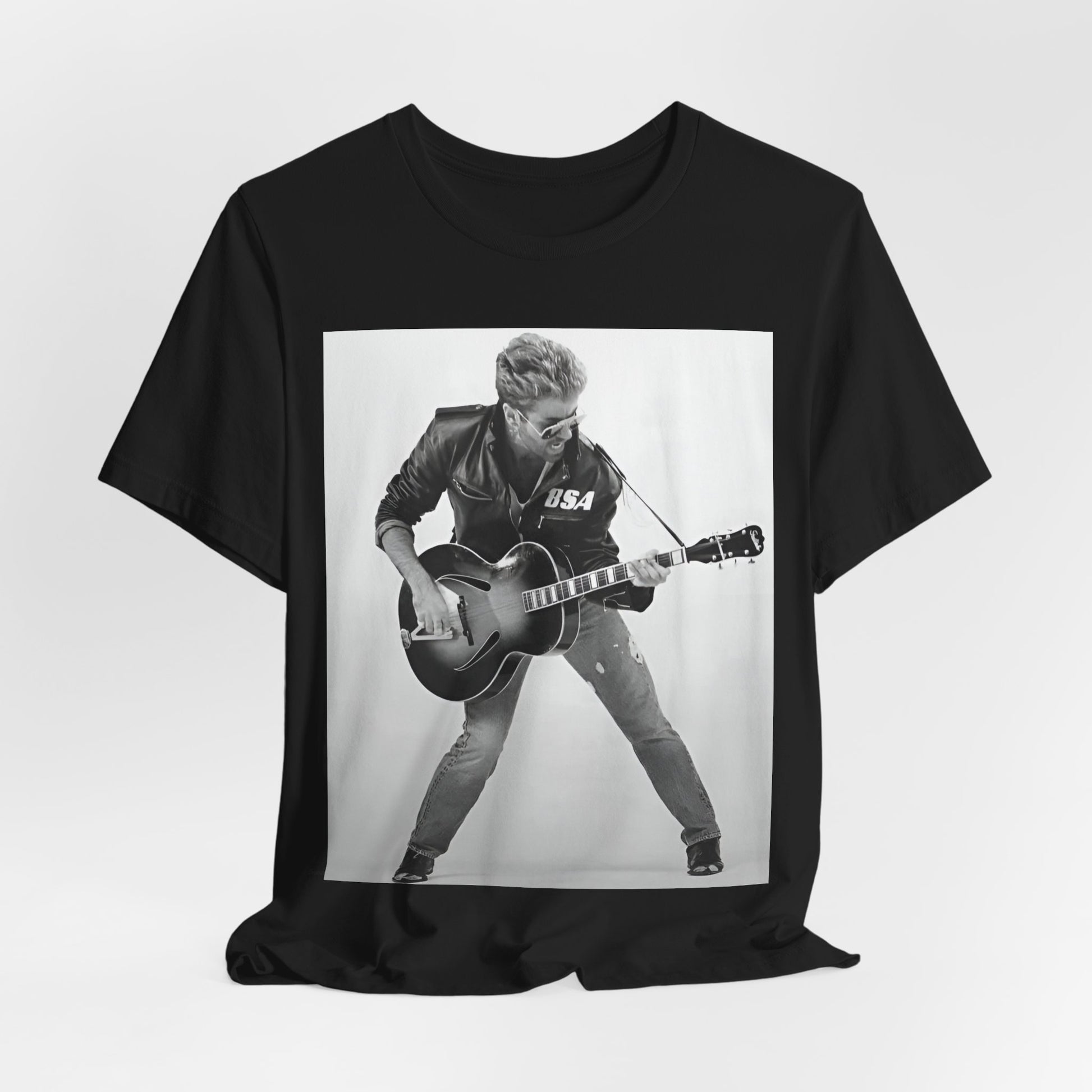 A black graphic t-shirt featuring a graphic of George Michael with a guitar.