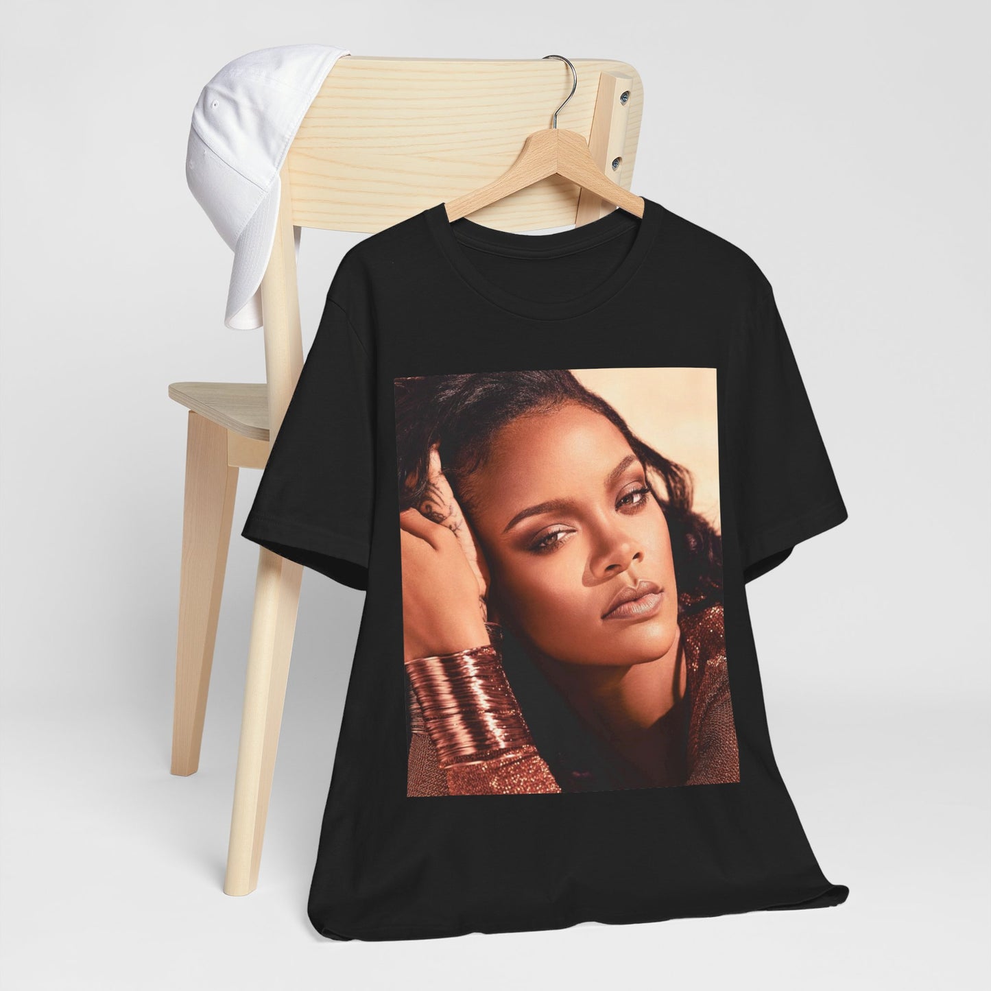 A black graphic t-shirt featuring a retro graphic related to Rihanna's 'Good Girl Gone Bad' album era.