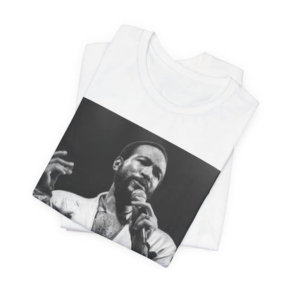 A black graphic t-shirt featuring a retro black and white photo or graphic of Marvin Gaye performing live on stage.