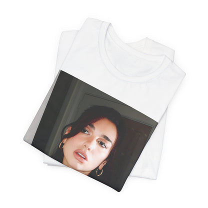 A black graphic t-shirt featuring a graphic of Dua Lipa, possibly with Parisian elements or a 'Paris' theme.