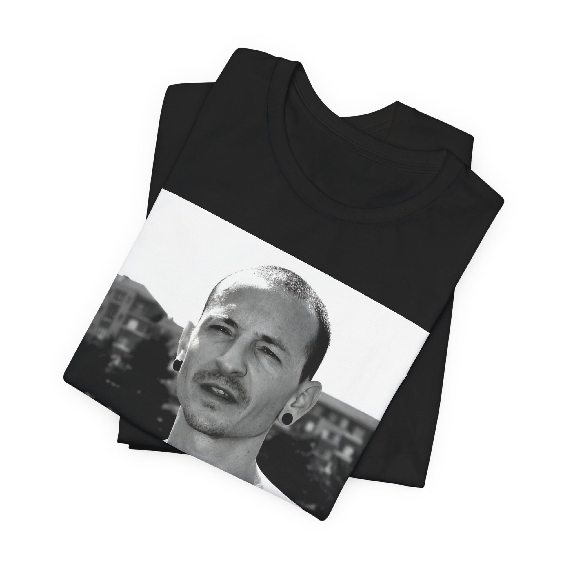 A black graphic t-shirt featuring a black and white graphic or photo portrait of Chester Bennington from Linkin Park.