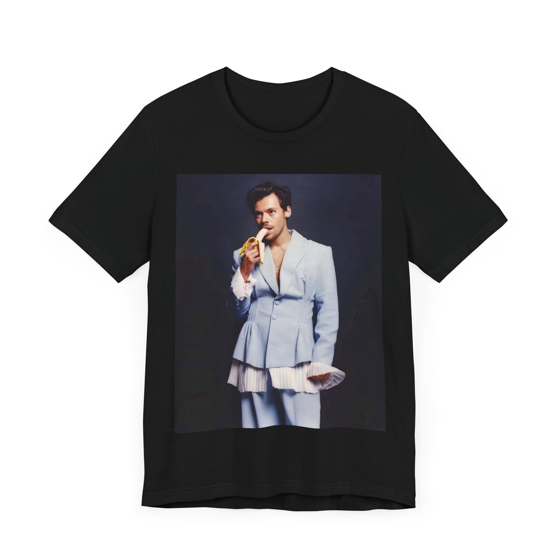 A black graphic t-shirt featuring a graphic related to Harry Styles and his One Direction legacy.