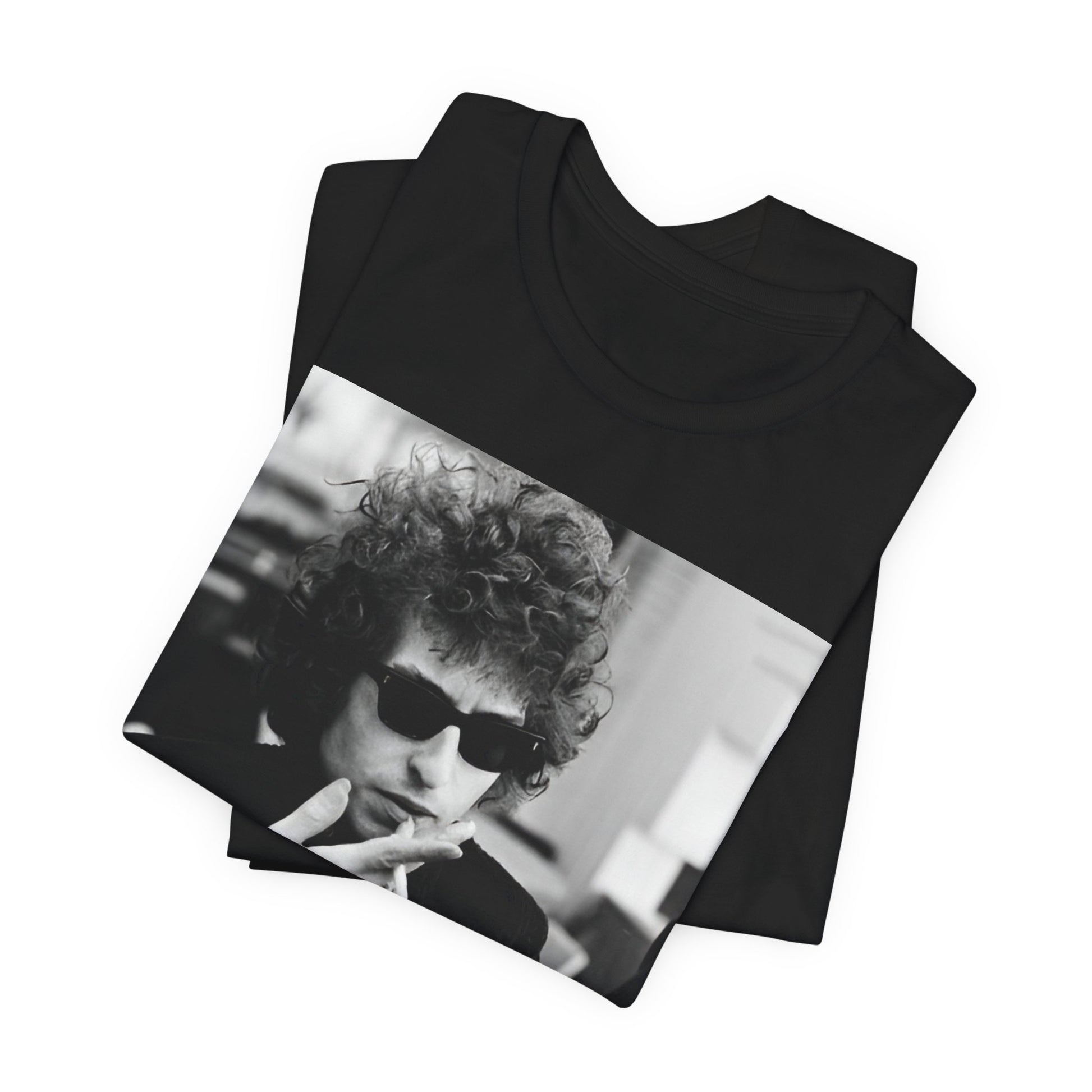A black graphic t-shirt featuring a retro black and white graphic of Bob Dylan in a rebellious pose.