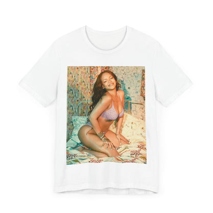 A black graphic t-shirt featuring a graphic of Rihanna with a beauty aesthetic.