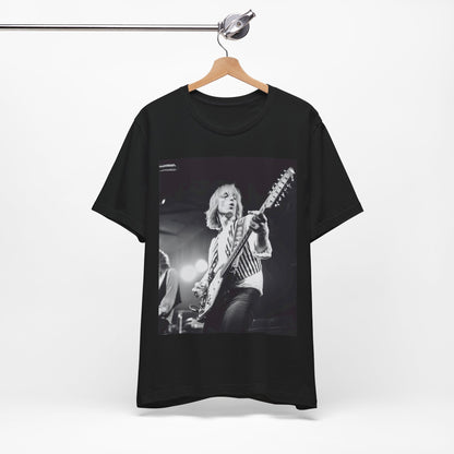 A black graphic t-shirt featuring a graphic of Tom Petty as a Rock & Roll Hall of Fame icon.