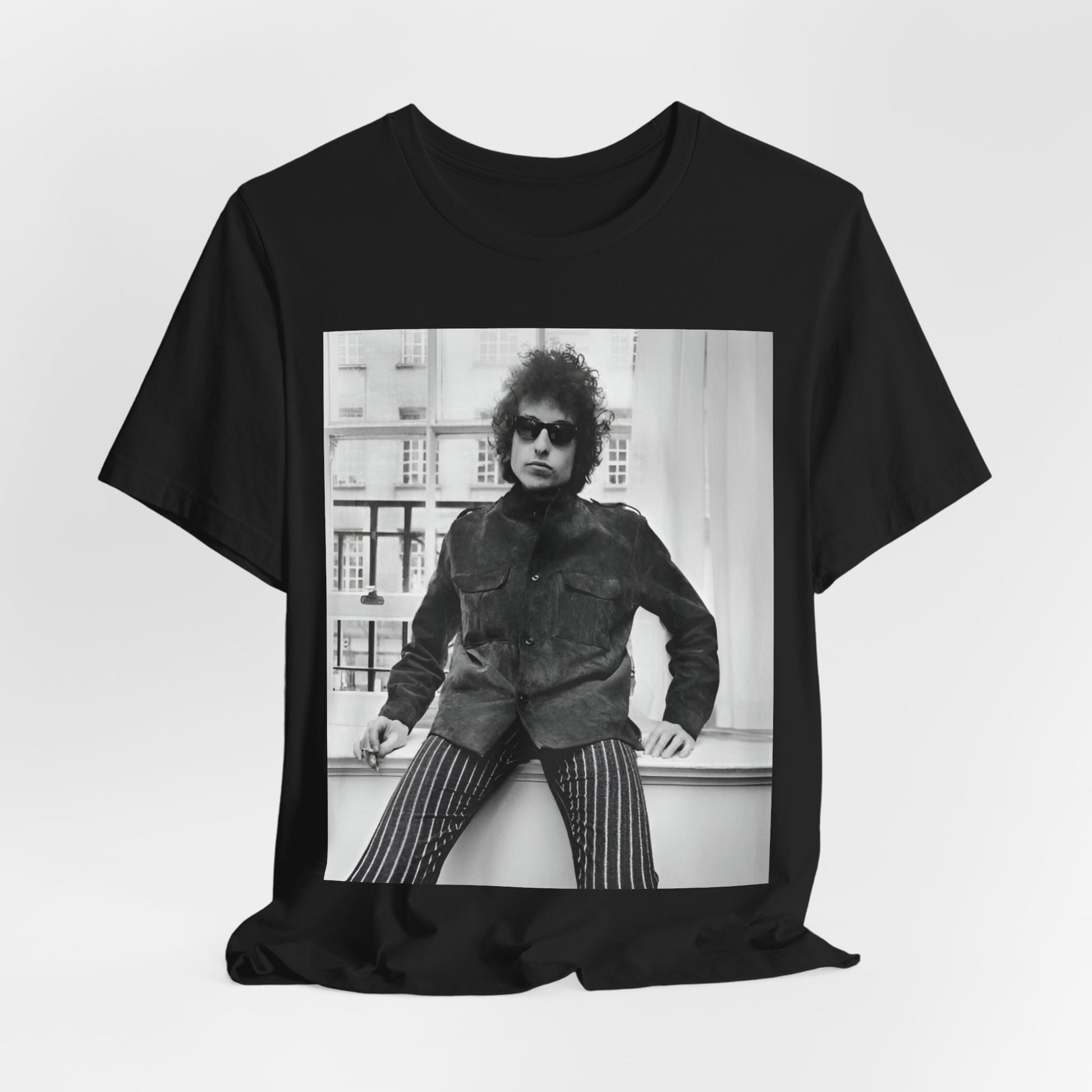 A black graphic t-shirt featuring a graphic related to Bob Dylan's 'Highway 61' era, possibly with album art elements or iconic imagery.