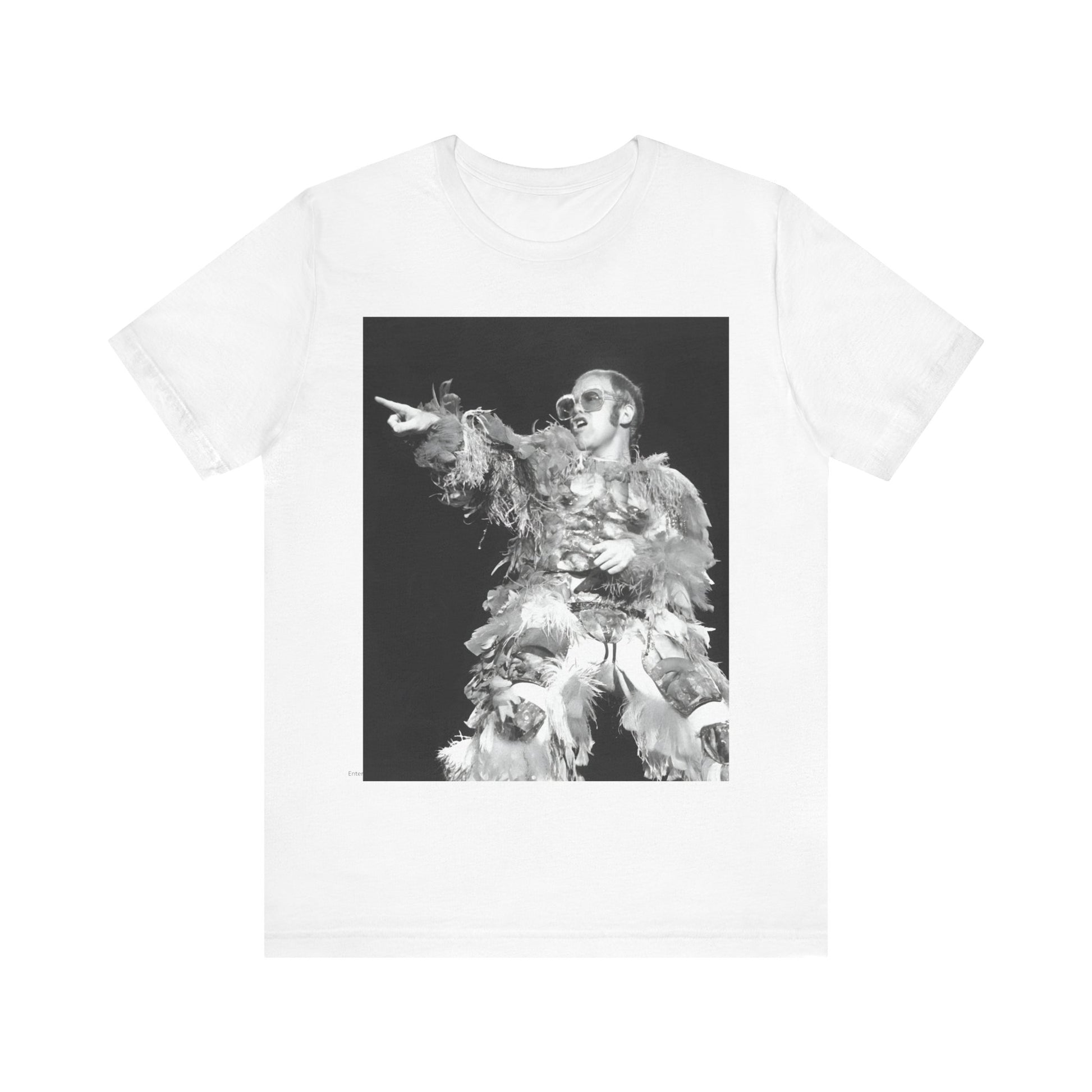 A black graphic t-shirt featuring a retro graphic of Elton John as a rock legend performing live.