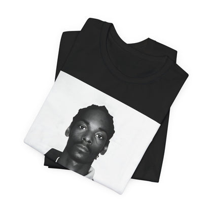 A black graphic t-shirt featuring a graphic of Snoop Dogg's mug shot.