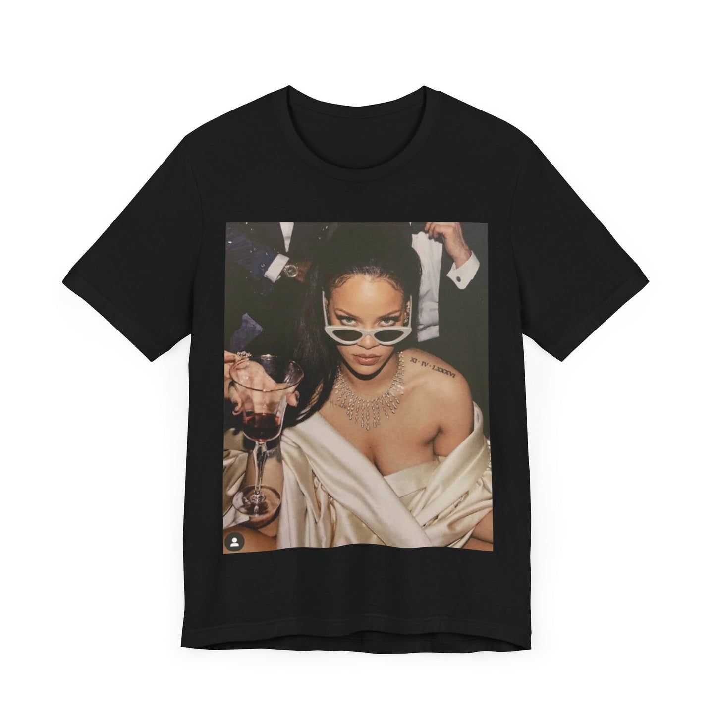 A black graphic t-shirt featuring a graphic of Rihanna as a 'Bad Gal Riri' fashion icon.