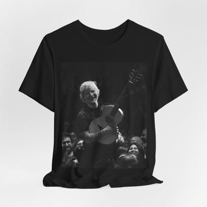 A black graphic t-shirt featuring a photo of Ed Sheeran performing live with his guitar.