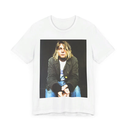 A black graphic t-shirt featuring an iconic graphic of Kurt Cobain from Nirvana.