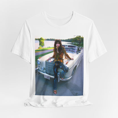 A black graphic t-shirt featuring a retro 70s photo of Aerosmith band members in a bohemian style, posing with a classic Mercedes car.