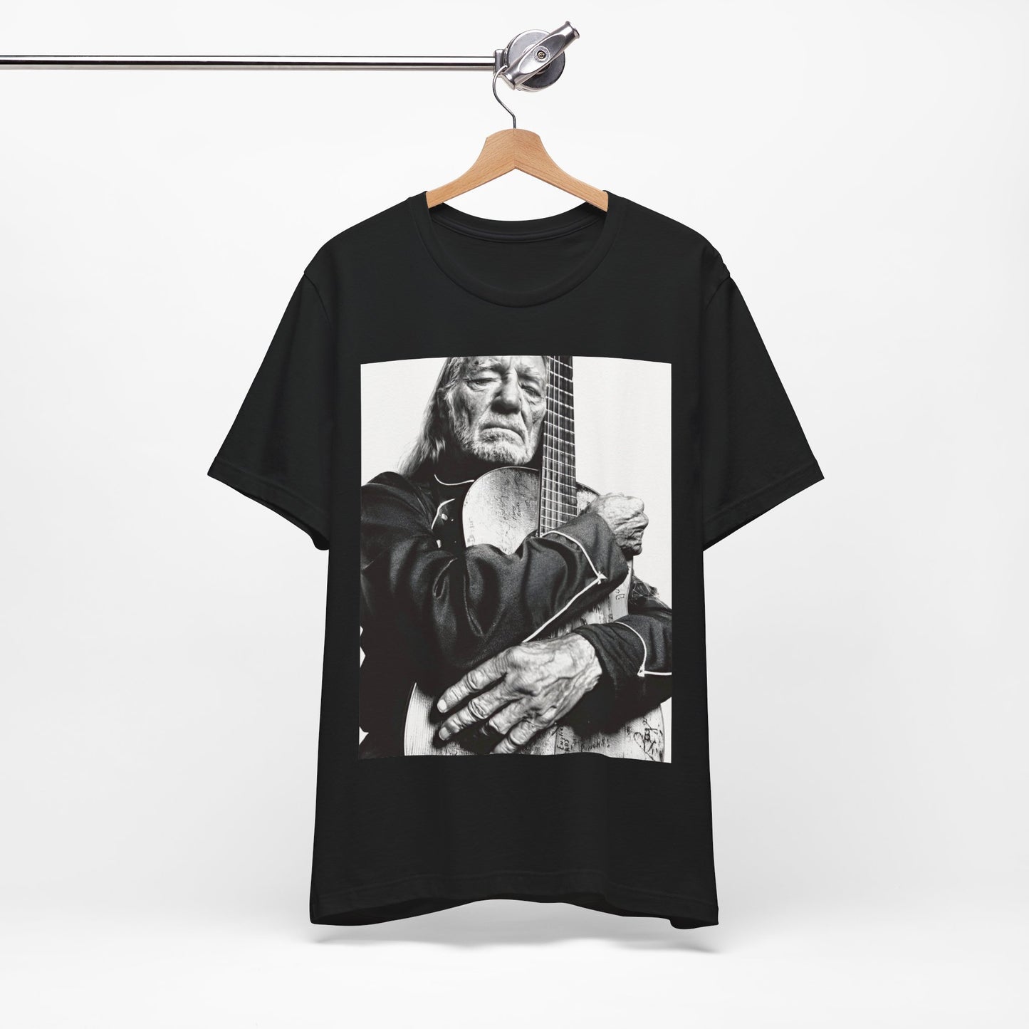 A black graphic t-shirt featuring a vintage country legend graphic of Willie Nelson.