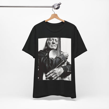 A black graphic t-shirt featuring a vintage country legend graphic of Willie Nelson.