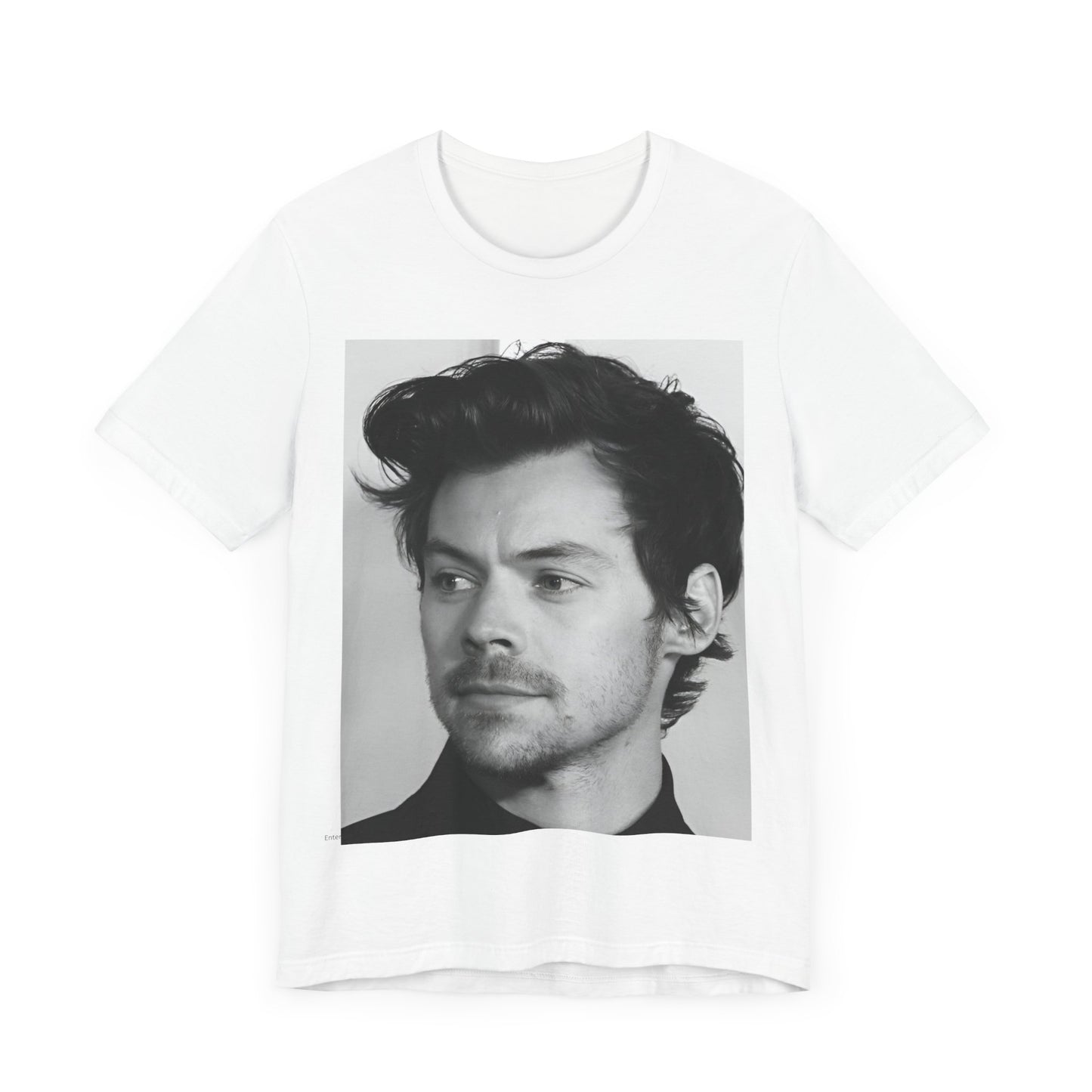 A black graphic t-shirt featuring a black and white, monochrome graphic or photo of Harry Styles.