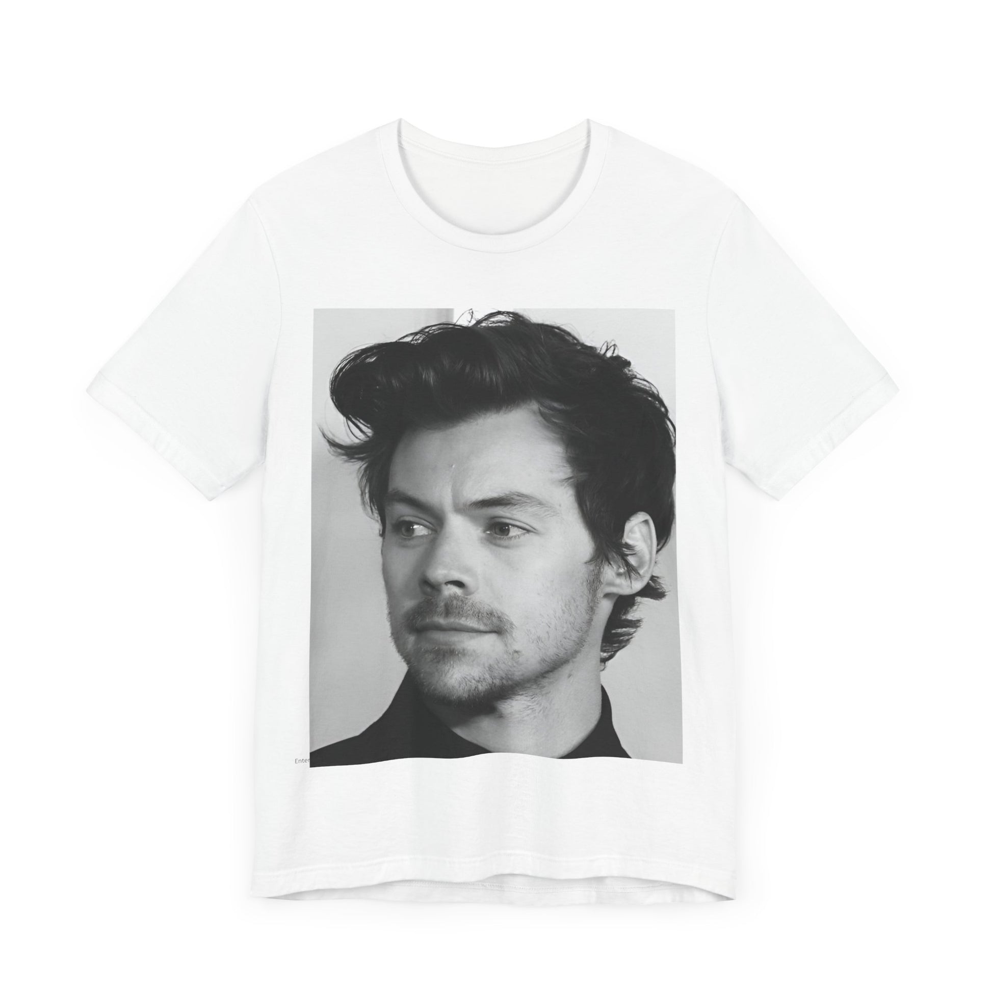 A black graphic t-shirt featuring a black and white, monochrome graphic or photo of Harry Styles.